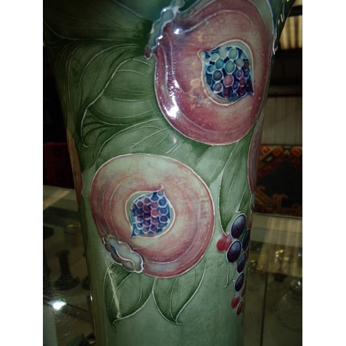 25 - Early / Mid 20th C Signed William Moorcroft Pomegranate pattern vase with flared rim (25cm high), th... 