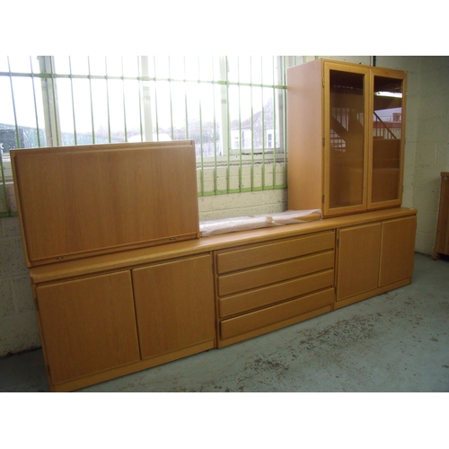 368 - Omann Lightwood lounge suite comprising of low base with four central drawers flanked by four cupboa... 
