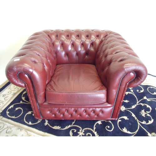 392 - Red leather Chesterfield type armchair