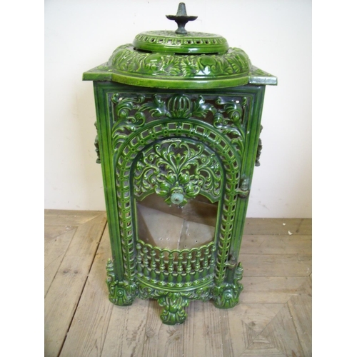 295 - Late 19th C French cast metal and green enamel stove converted into a display light (70cm high)
