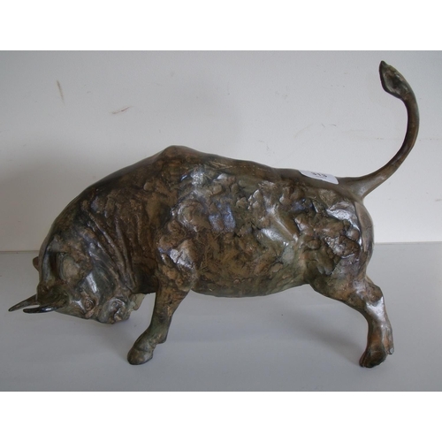 313 - Circa 1970s bronze figure of a charging bull with an unusual patina, the base stamped CHENET (29cm h... 