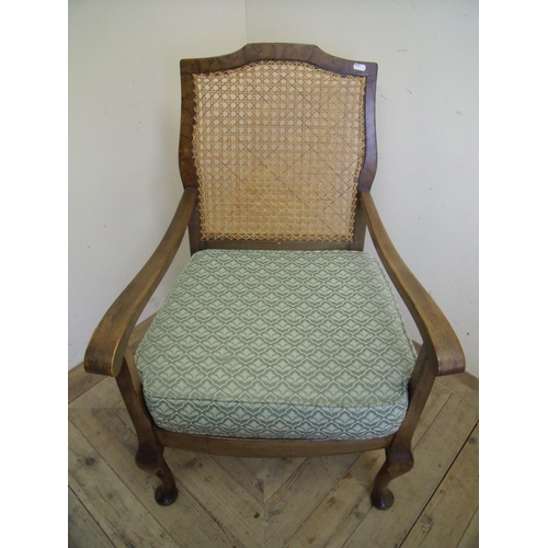 377 - 1930s walnut framed armchair with cane work back and drop in seat