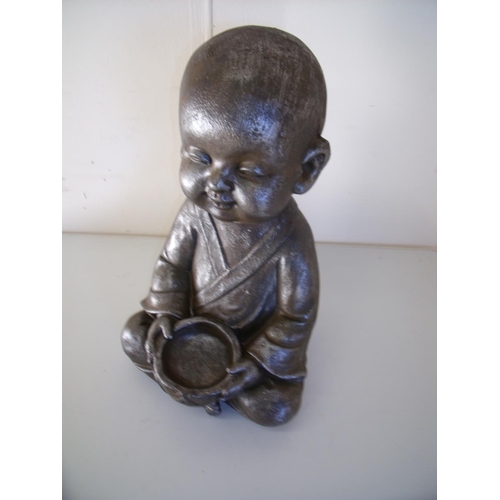 49 - Composite figure of seated baby Tibetan style monk (36cm high)