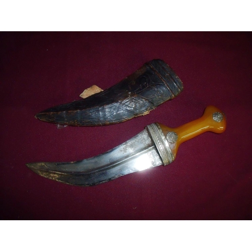 106 - Eastern white metal mounted Jambiya knife with 8.5 inch curved blade with amber style hilt and leath... 