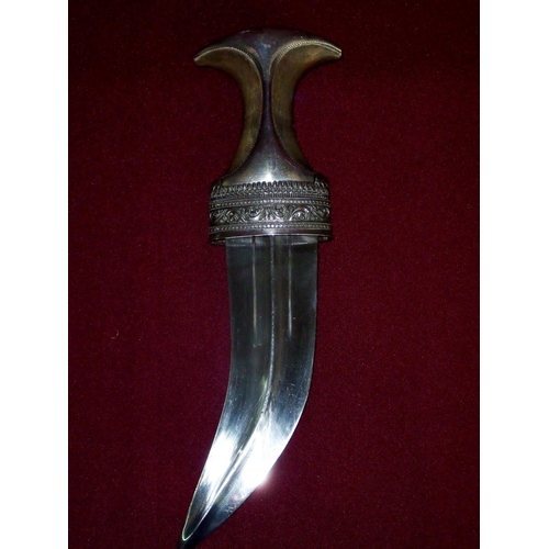 108 - Fine quality Omani Jambiya knife with rhino horn hilt and original silver braid belt, the hilt and s... 