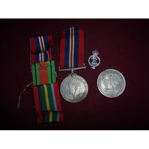 19 - 1939-45 War Medal, a stay bright TA lapel badge and an American coin