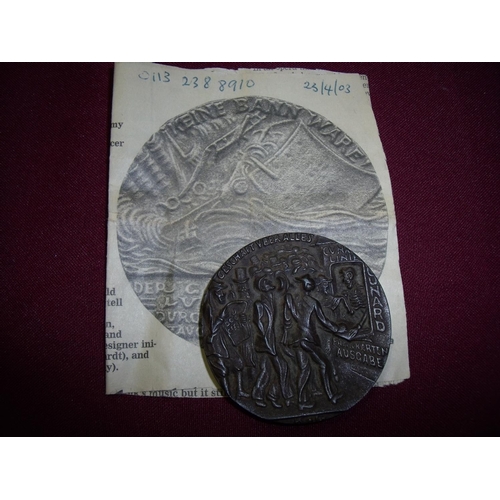 2 - Lusitania medal with associated newspaper cutting