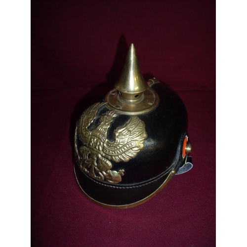 20 - Fine quality copy of a German Pickelhauben helmet complete with liner and brass mounts