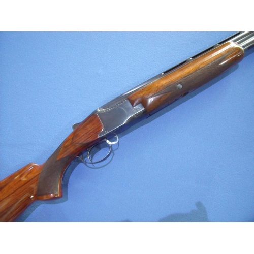 324 - Browning-Fabrique Nationale 12 bore over & under single trigger ejector shotgun with 32 inch barrels... 