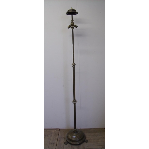 26 - Early 20th C brass telescopic standard lamp with three claw feet