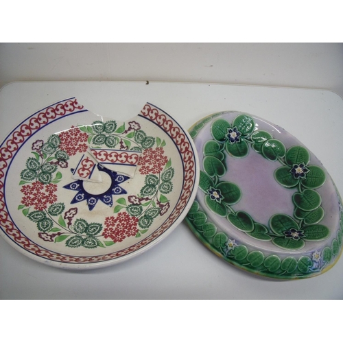 86 - Victorian Majolica oval bread plate with floral pattern and another charger (A/F) (2)