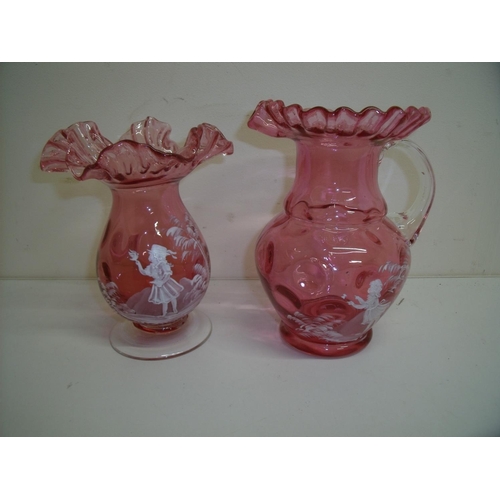 94 - Mary Gregory style cranberry glass vases of bulbous form with frilled edge and a similar jug (18.5cm... 