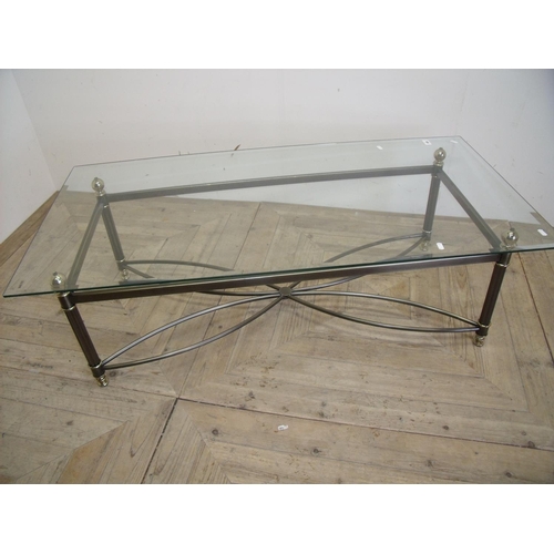 413 - Modern rectangular bevelled edge glass top table on metal base (64cm x 127cm x 40cm)