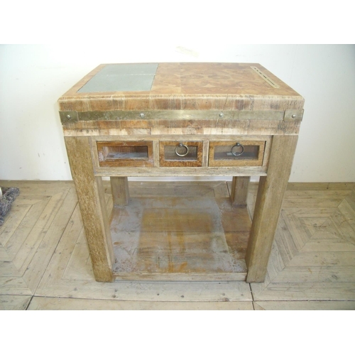 416 - Butchers block with three drawers, figured wood top inset with two slate panels, brass knife rest an... 