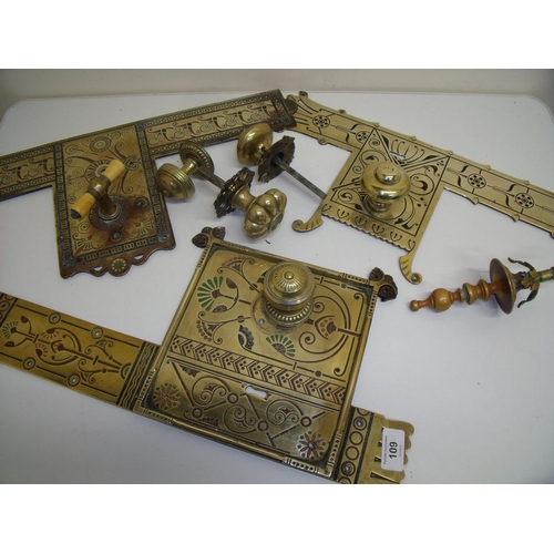 109 - Three assorted 19th/20th brass door lock plates and handles of various designs including Art Nouveau... 