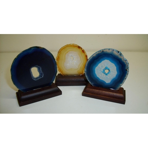 12 - Three Natural History specimens of geode type gem stone slices mounted on rectangular plinths (appro... 