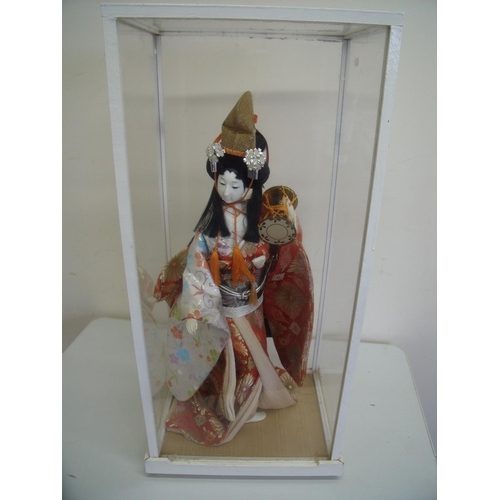 24 - Glazed cased figure of a Geisha girl (32cm x 25cm x 68cm)