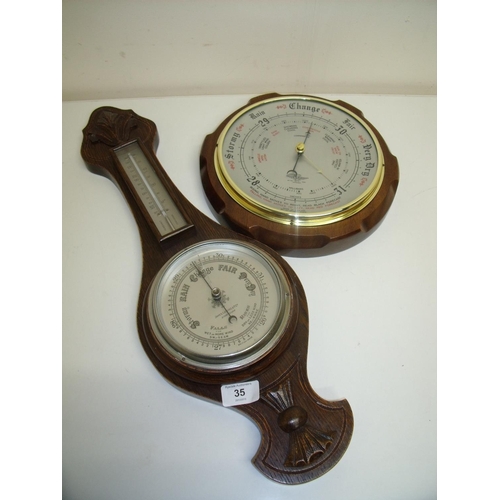 35 - Small carved oak cased wall barometer by James Lucking & Co Ltd Birmingham and a circular steel face... 