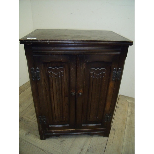 366 - Oak Old Charm two door side cabinet with linen fold detail (48cm x 32cm x 55cm)