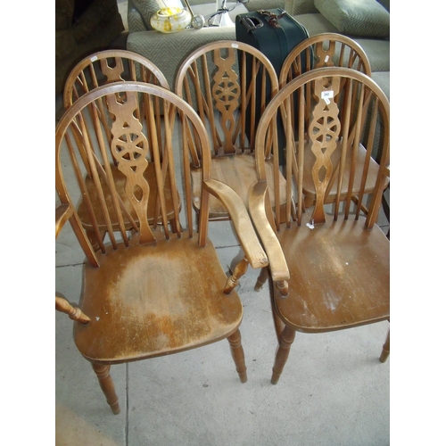 392 - Set of five (3+2) wheel back dining chairs on turned supports and H shaped under stretchers