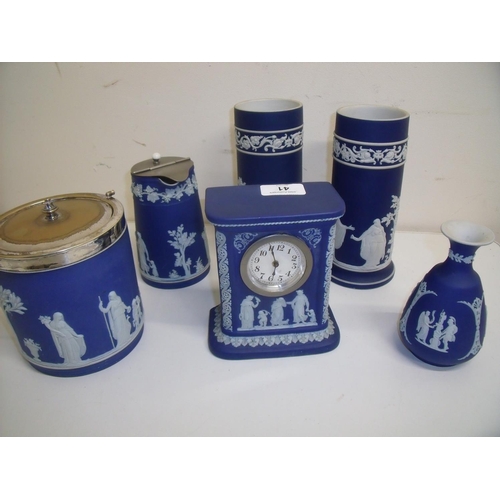 41 - Wedgewood blue Jasperware biscuit barrel with plated top, a mantel clock (chip to base), bud vase, w... 