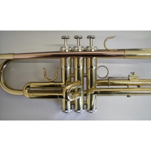 57 - Hard cased Odyssey brass trumpet with music book