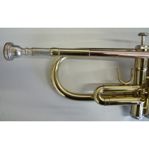 57 - Hard cased Odyssey brass trumpet with music book
