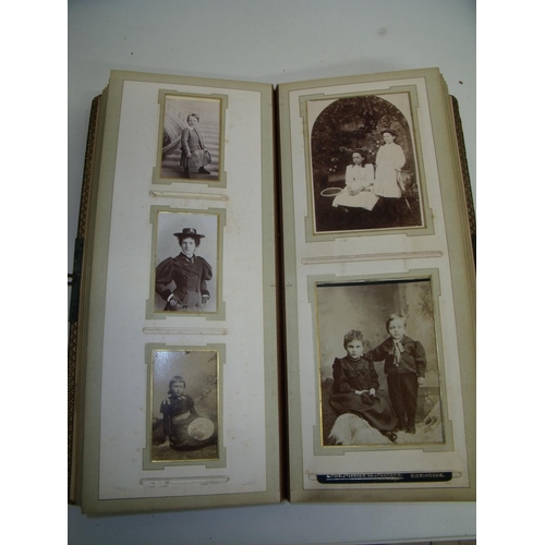 61 - Victorian leather bound photograph album with a selection of various portrait and family photos, the... 