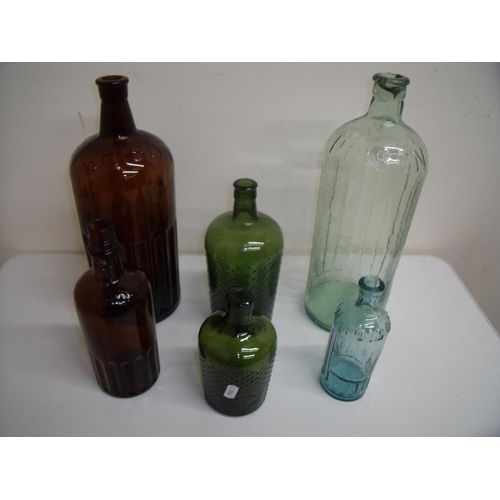 71 - Two large poison bottles (approx. 35cm high), two other green glass bottles with tapering bodies, a ... 