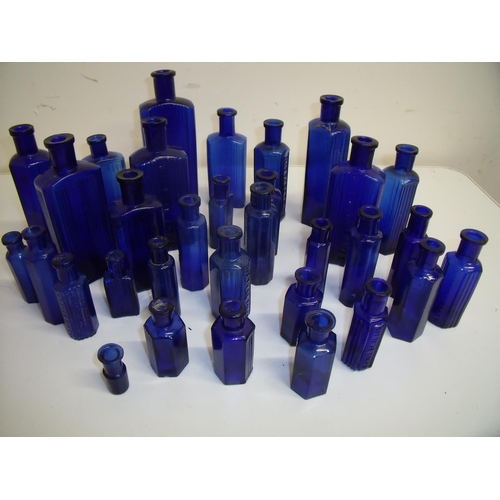 77 - Collection of various blue glass poison bottles in one box