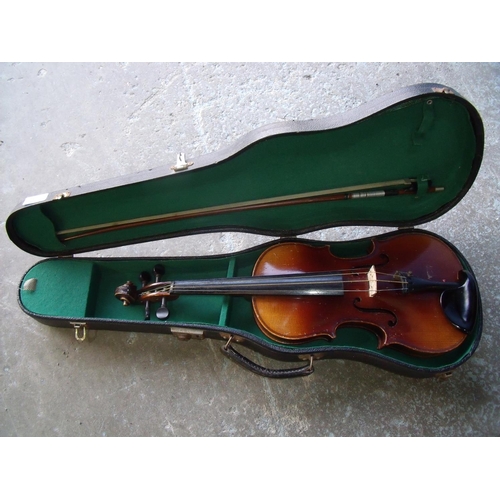 17 - Cased unnamed violin with bow