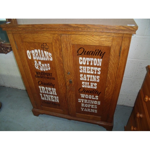 395 - Edwardian oak side cabinet with shelved interior enclosed by two panelled cupboard doors on raised b... 