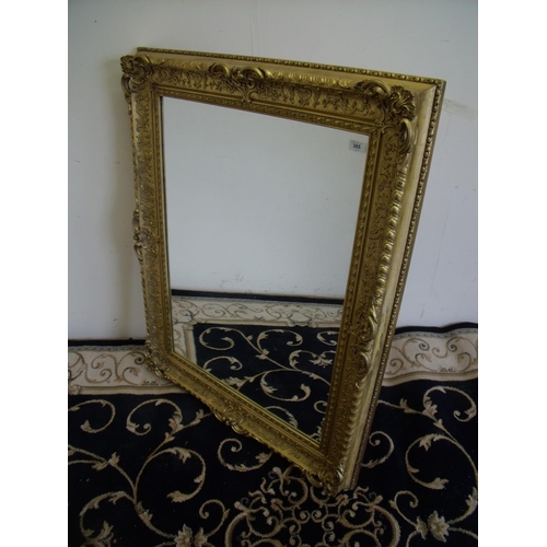 421 - Heavy gilt framed wall mirror (86cm x 109cm)