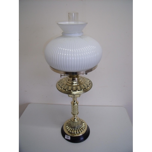 129 - 19th/20th C Arts & Crafts style brass oil lamp with opaque glass shade (68cm high)
