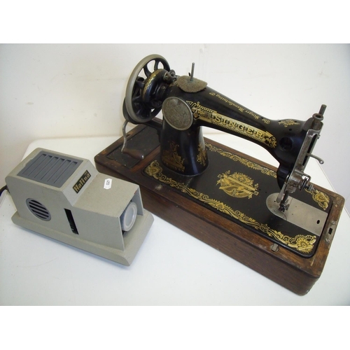 97 - Oak cased Singer sewing machine and a vintage Halina 150 Projector (2)