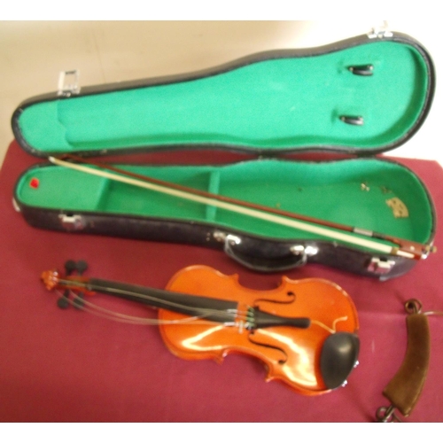 1 - Cased small scale violin/fiddle & bow, with paper label for Palatino (back board 29cm) and a rest pl... 