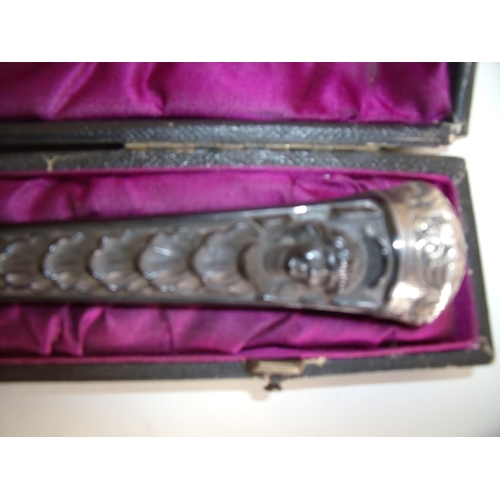 2 - Victorian cased conductors baton of carved ebony with embossed silver hallmarked mounts