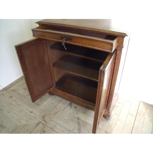 266 - 19th C oak side cabinet with single drawer above two panelled cupboard doors with shelved interior, ... 