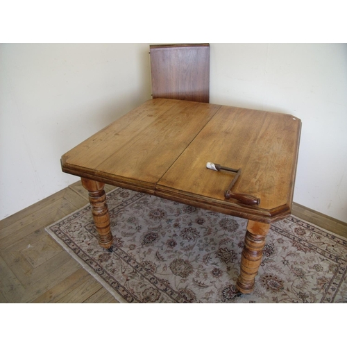 268 - Victorian wind-out beech dining table with additional leaf on turned supports