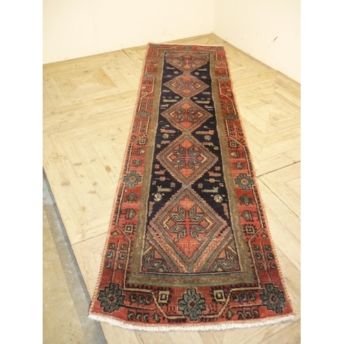 242 - Persian style woollen runner rug (75cm x 265cm)
