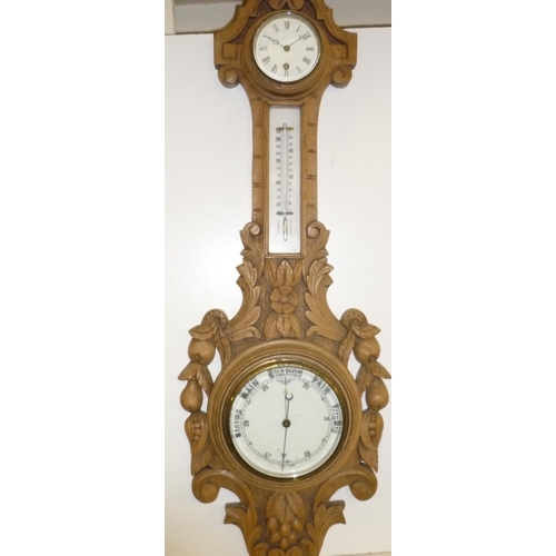 62 - Victorian wall combination barometer with clock, thermometer and barometer gauge in heavily carved f... 