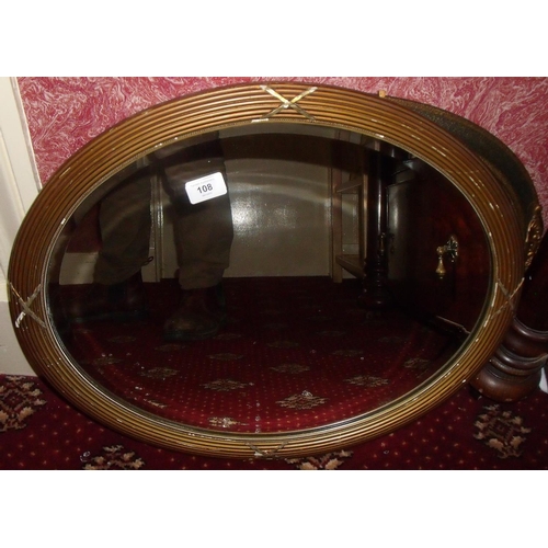 108 - Gilt framed oval bevel edged wall mirror and another (2)