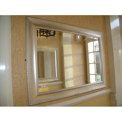 383 - Pair of rectangular bevelled edge wall mirrors (110cm x 80cm)