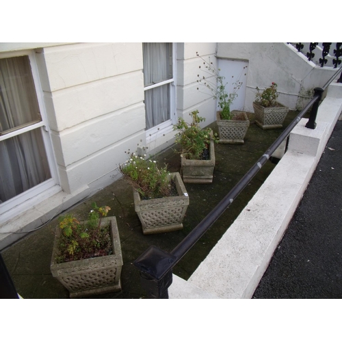 392 - Set of four composite stone planters and a rectangular stone planter