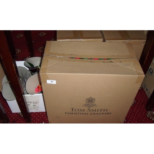 41 - Three cases of Tom Smith Christmas crackers and other Christmas party items