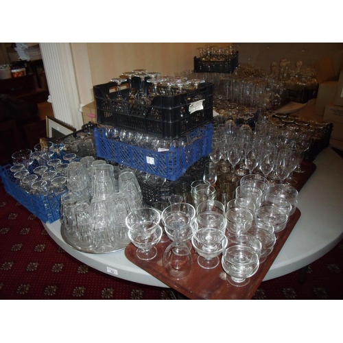 73 - Extremely large selection of drinking and table glassware on one table, including wine glasses