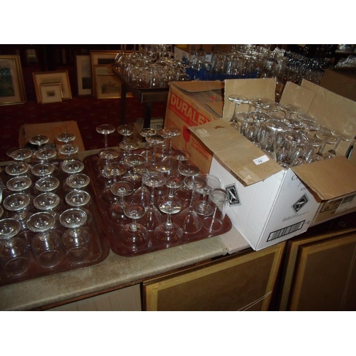 75 - Extremely large collection of catering/bar glassware including high balls, martini glasses, flutes e... 