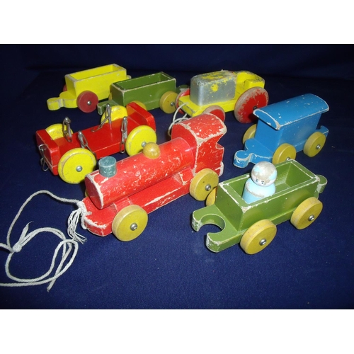 181 - Selection of wooden pull-along trains