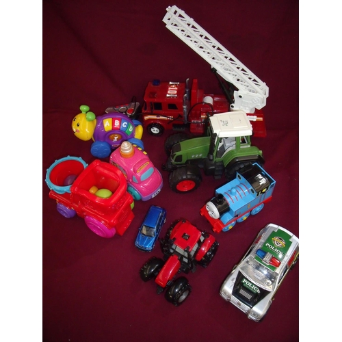 180 - Selection of various assorted toys including Thomas the Tank Engine, tractors, fire engine toy tract... 