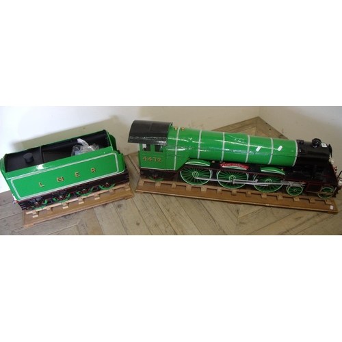 168 - Large wooden handmade model of the Flying Scotsman labelled Flying Scotsman to Alice Springs and LNE... 